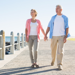 Couple walking along seafront