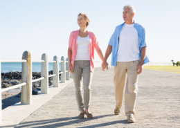 Couple walking along seafront