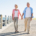 Couple walking along seafront