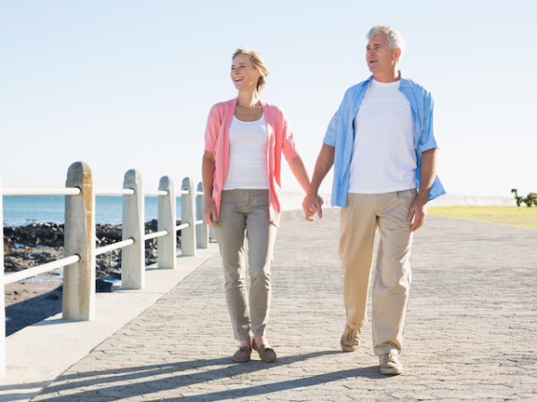 Couple walking along seafront